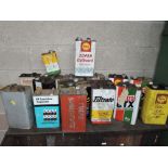 A selection of vintage fuel and oil cans including BP Castrol and Shell