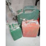 A selection of vintage garage fuel cans including 2gallon and jerry can