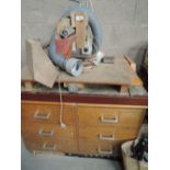 A vintage machine shop chop saw with extractor