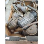 A selection of vintage copper and cast stove and travellers kettles and pots