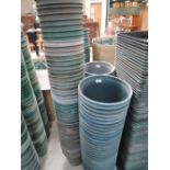 Three stacks of large polypropylene plant pots