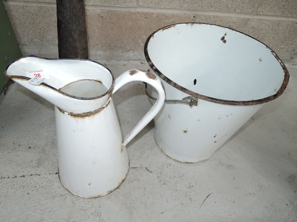 A vintage white enamel bucket and jug