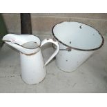 A vintage white enamel bucket and jug