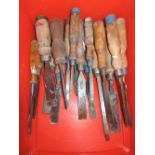 A box of various woodwork chisels