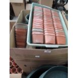 A box of various pots and trays