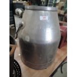 A vintage stainless steel dairy container