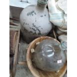 Two vintage glass carboys and wooden bucket