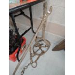 A vintage cast iron cart jack