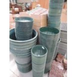 Four stacks of polypropylene plant pots and trays