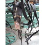 A working set of Driving Harness, coprising saddle & britching, britching straps, crupper, back band