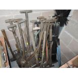 A selection of vintage garden and landscaping shovels forks and similar digging tools