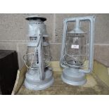 Two vintage storm lanterns