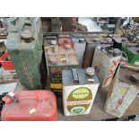 A selection of vintage oil fuel and petrol cans including Shell BP and EVCO