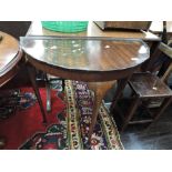 A period style mahogany demi lune hall table