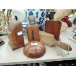 A selection of vintage wooden items including butter paddles and book ends