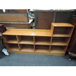 A vintage light low bookshelf