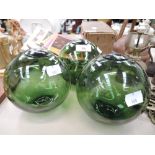 A selection of vintage green glass fishing floats