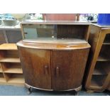 A 1930s oak bow front sideboard and a matched display top