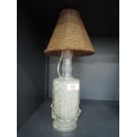 A vintage oriental style bottle lamp and beaded shade