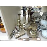 A selection of vintage brass wares including candle sticks