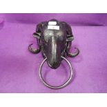 A vintage towel or cloth holder in the form of a rams head