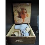 A vintage 1960's baby blue hair dryer by Pifco