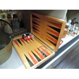 A vintage backgammon games board and counters