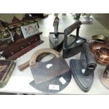 A selection of vintage stove irons and herb cutters