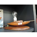 A vintage 1950's design oak ship or boat style table lamp