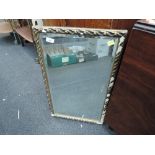 A gilt plaster wall mirror