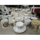 A selection of vintage coronation tea cups mugs etc