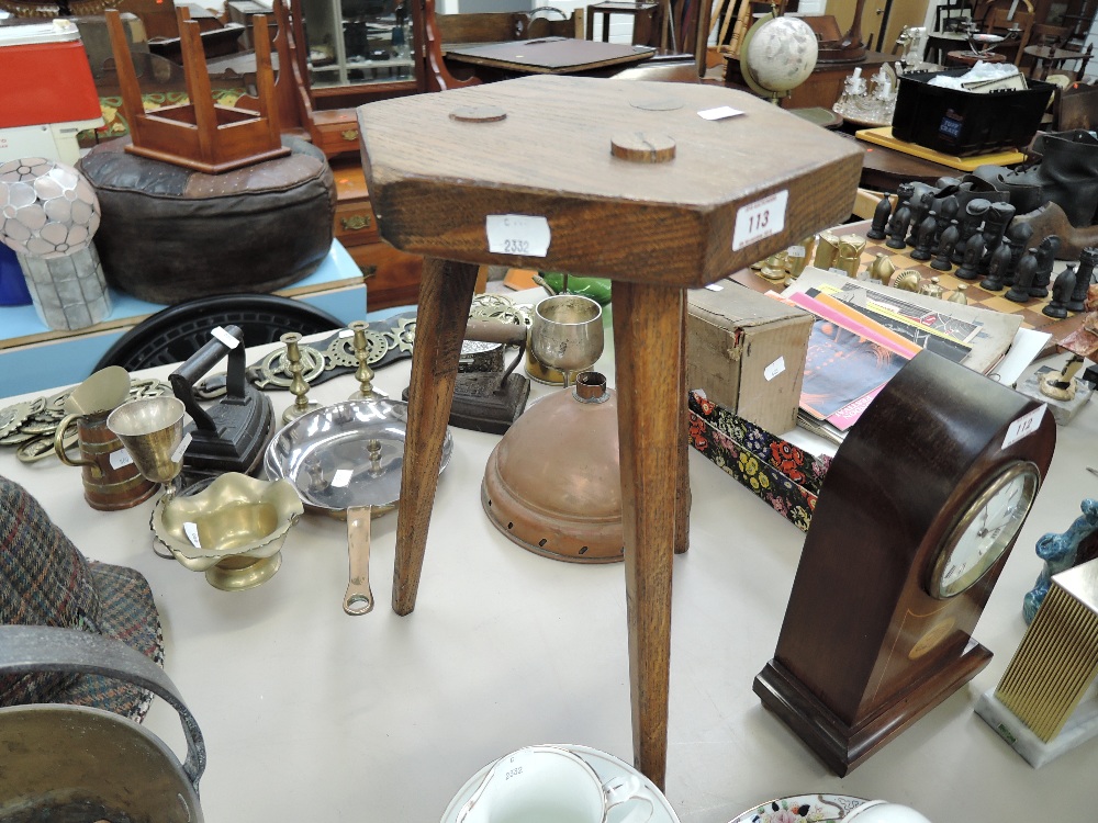 a vintage arts and crafts design three legged oak stool