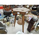 a vintage arts and crafts design three legged oak stool