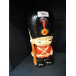 A vintage ceramic money box in the style of a Royal guard