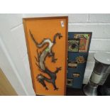 A vintage metal work wall hanging and a decorative kitchen picture