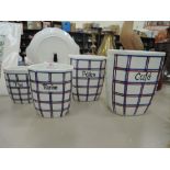 A set of vintage graduated kitchen containers with French print