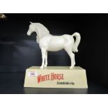 A vintage White Horse scotch whisky advertising model