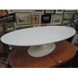 A vintage Arkana coffee table, on painted tulip style base, in white