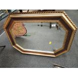 A vintage wall mounted mirror gilt effect frame`