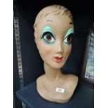 A vintage plastic moulded 70's stylised wig or shop display head