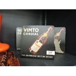 A selection of vintage tin shop advertising display stands for Vimto