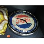 A vintage wall mounted Pepsi Cola wall clock