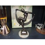 A vintage bronze effect art deco style female dancer