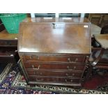 A mid to late 20th Century mahogany bureau of traditional form