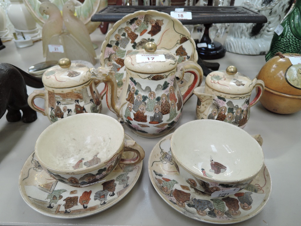 A vintage ceramic tea set for two Japanese Satsuma ware hand decorated