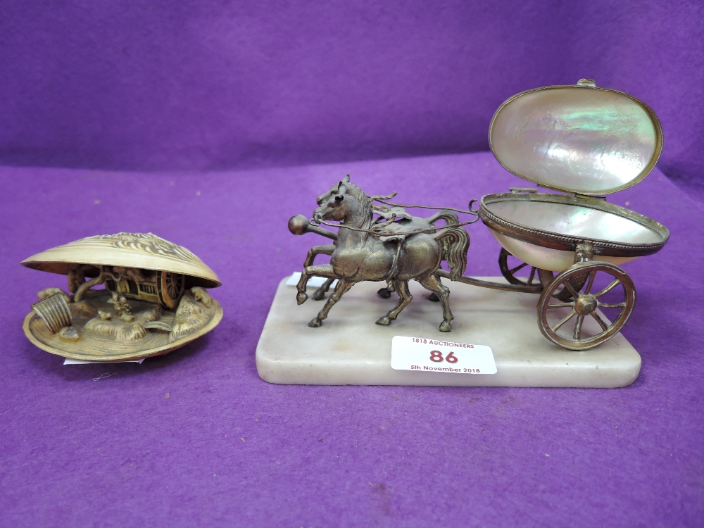 A vintage horse and carriage model styled in brass with mother of pearl container and carved shell