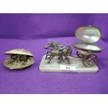 A vintage horse and carriage model styled in brass with mother of pearl container and carved shell