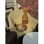 A cane conservatory chair, brass frame mirror, a vintage cast and brass torchere and a rustic wall