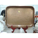a vintage heavy set copper tray with brass handles