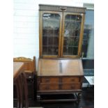 An early 20th Century oak bureau bookcase